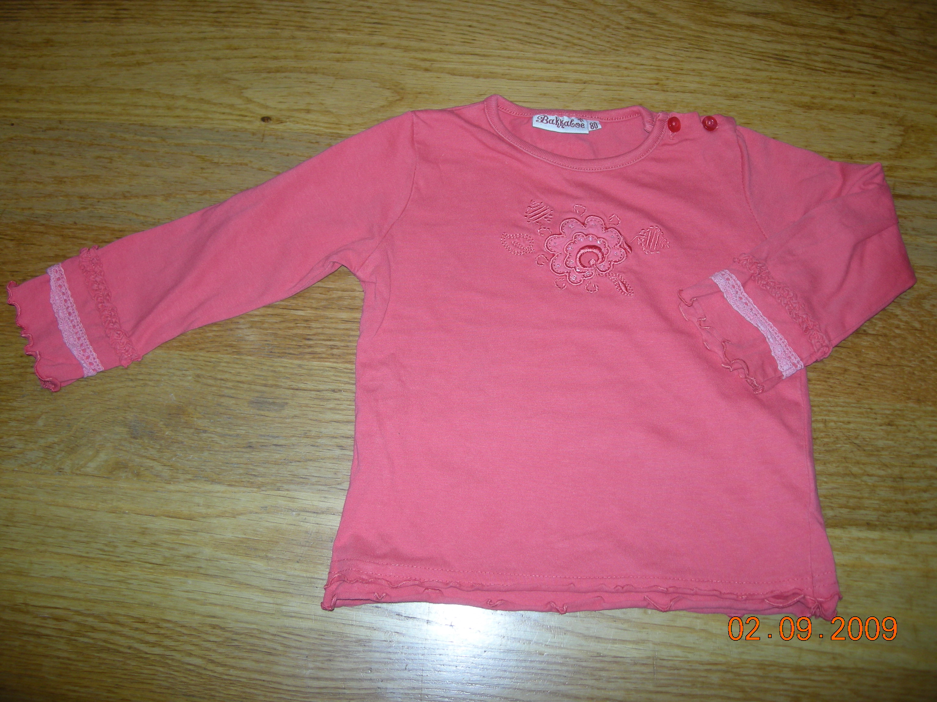 Klik hier om een vergroting van deze - Oranje-rood shirt maat 80 Bakkaboe - te bekijken!